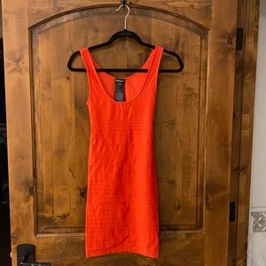 Fiery red Bebe body on dress.